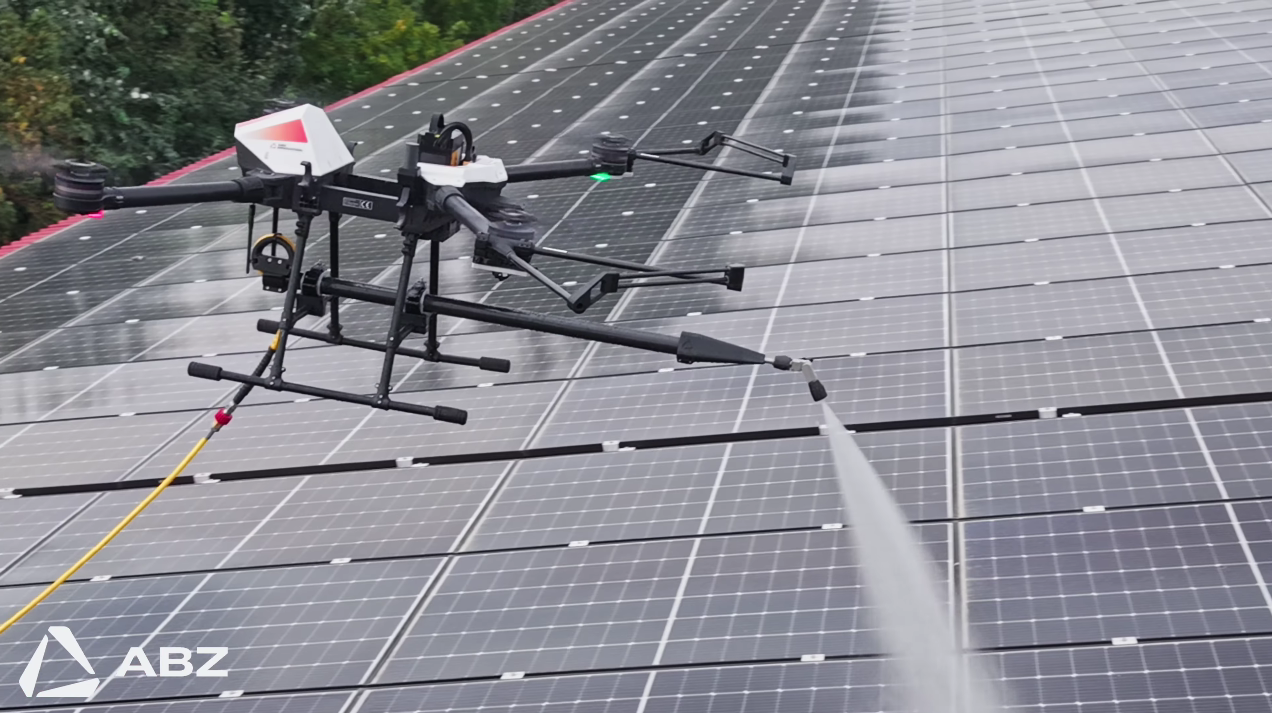 Drone cleaning solar panels with precision sprayer